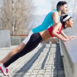 Young couple doing push-ups