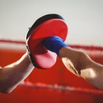 Female boxer practicing in the ring