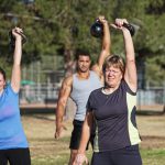 Middle Aged Woman Lifting Weights